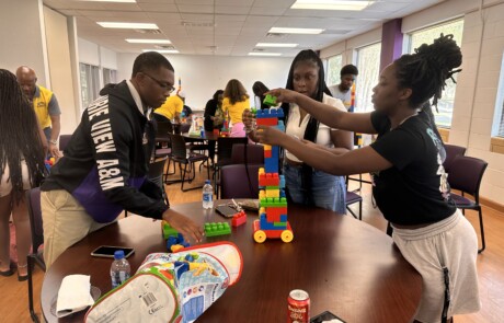 TLS students participating in a Lego building challenge