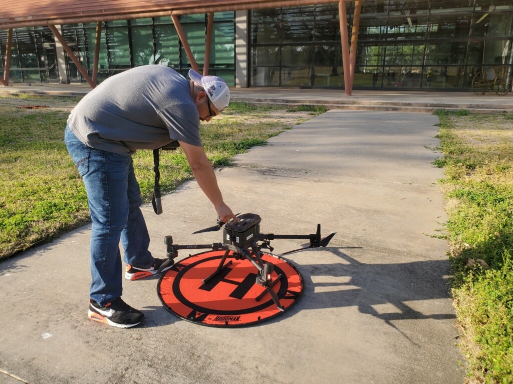 A student is using a research-grade drone to collect geospatial data. The collected data is analyzed using computer vision (CV), an advanced AI method, to identify various urban features.